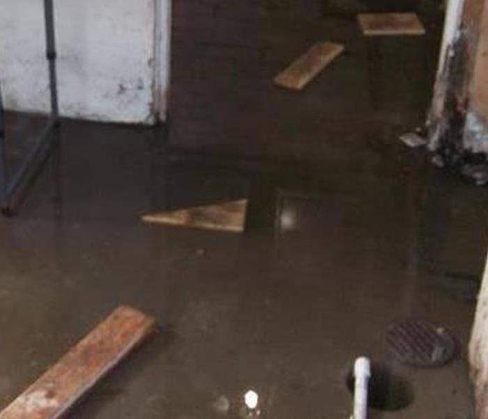 flotsam and murky water in a flooded basement